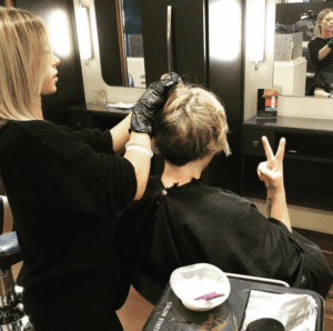 Hair stylist dying womans hair