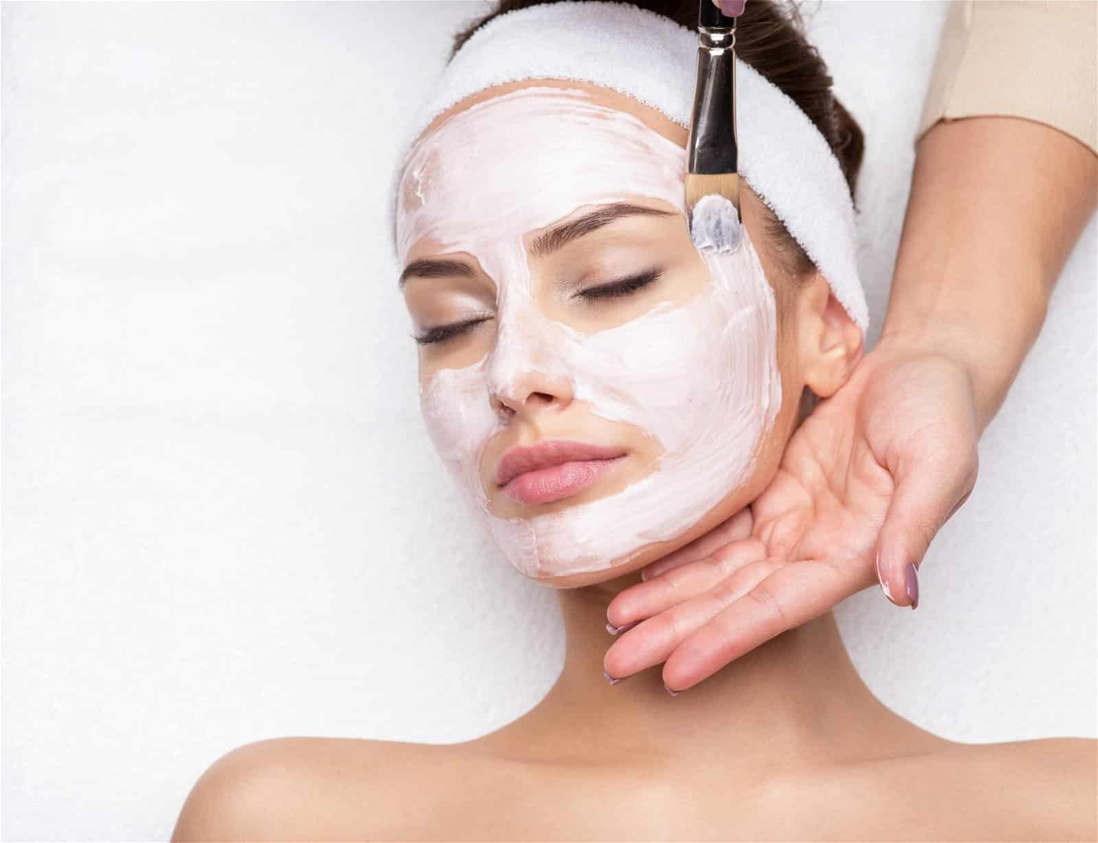 medical-Grade-Facial-scaled Facial being painted on by esthetician
