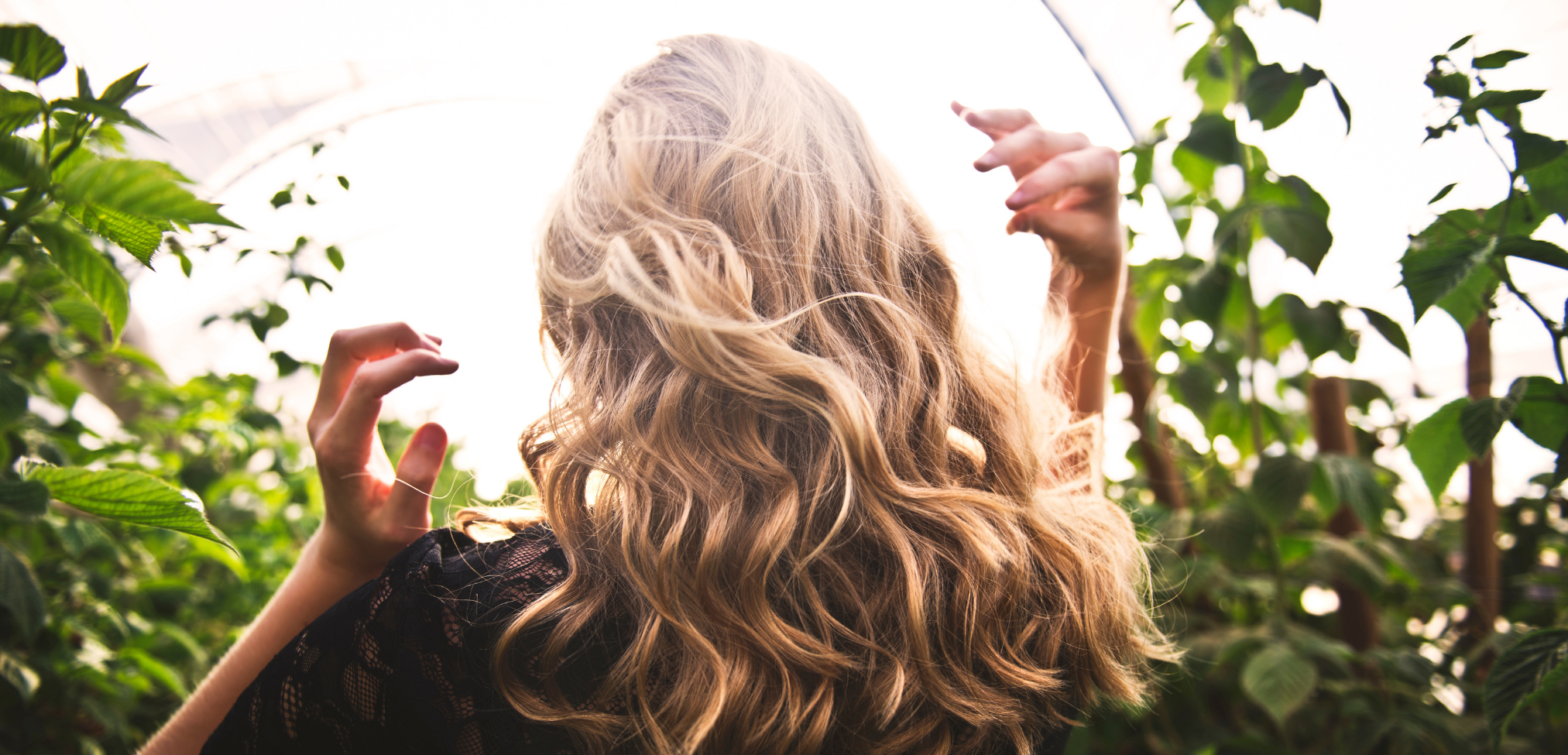 Woman surrounded by greenery | Dupre's Salon and Day Spa Woman surrounded by greenery | Dupre's Salon and Day Spa