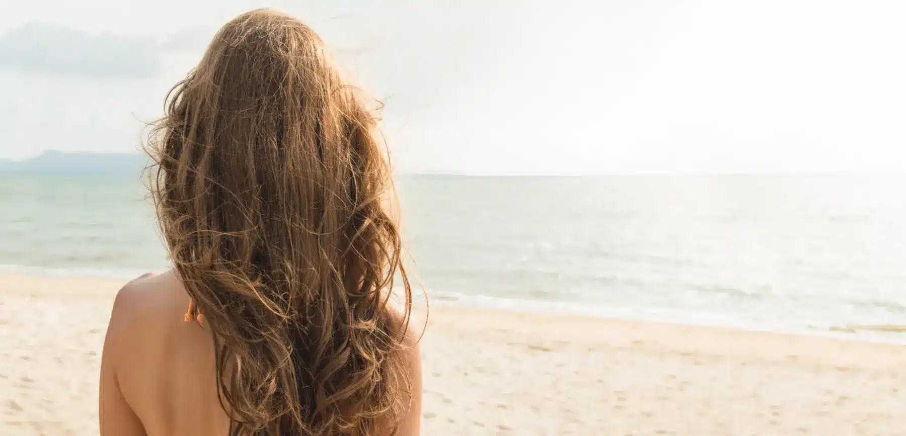 Woman at beach | Dupre's Salon and Day Spa